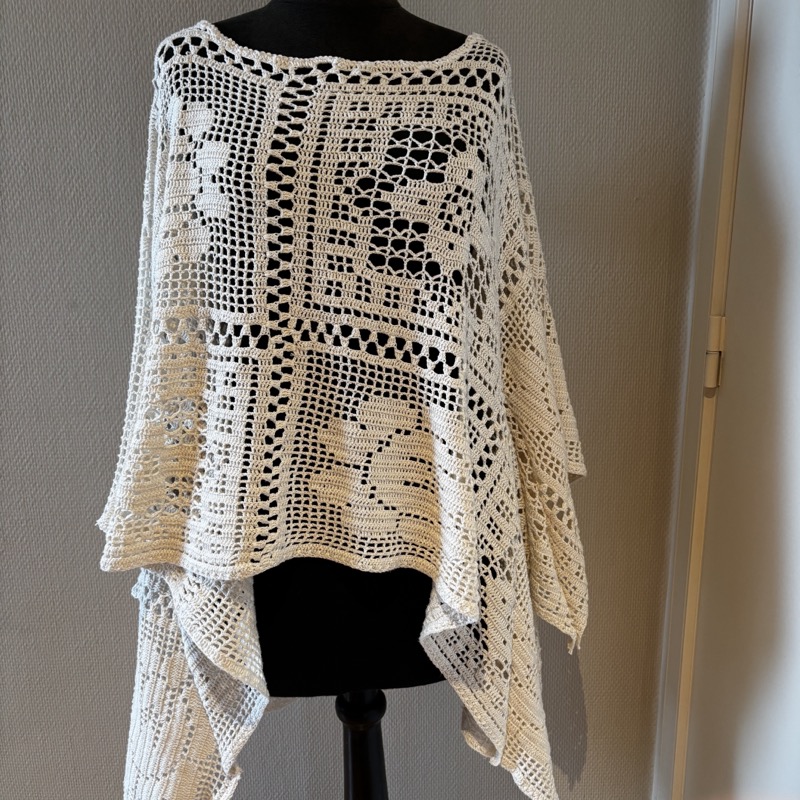 White crochet tunic on mannequin